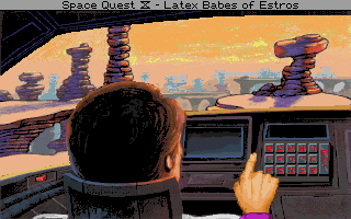 Roger Wilco seated in his time machine ship in Space Quest IV