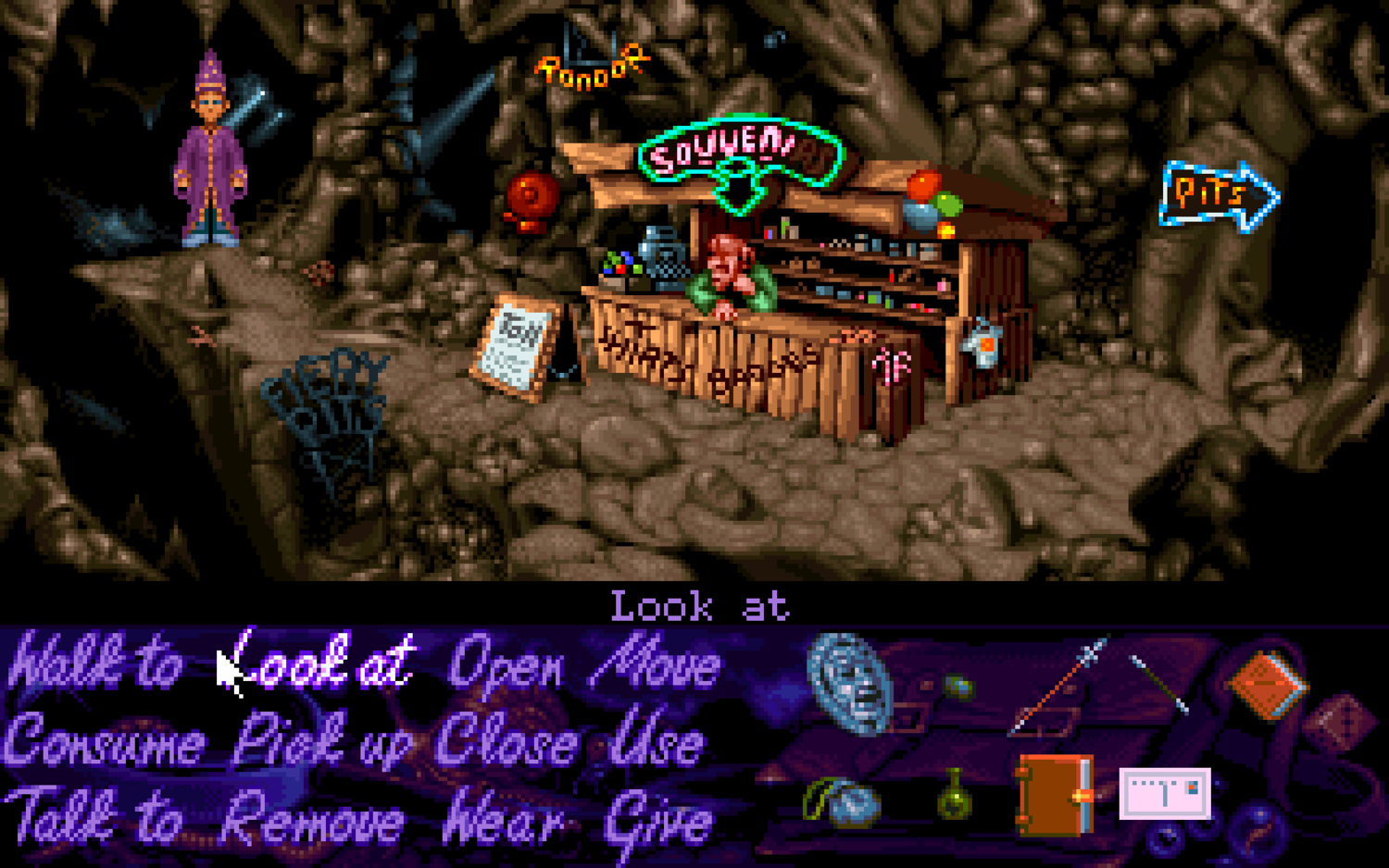 A screenshot of Simon the Sorcerer where Simon has landed in Sordid's dungeon, where there's a souvenir stand.