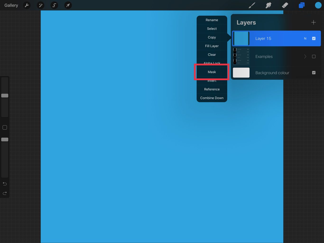 Screenshot showing Procreate with the layers palette open. There is a layer that is filled with blue, and next to this layer a popup which has the option 'Mask' highlighted.