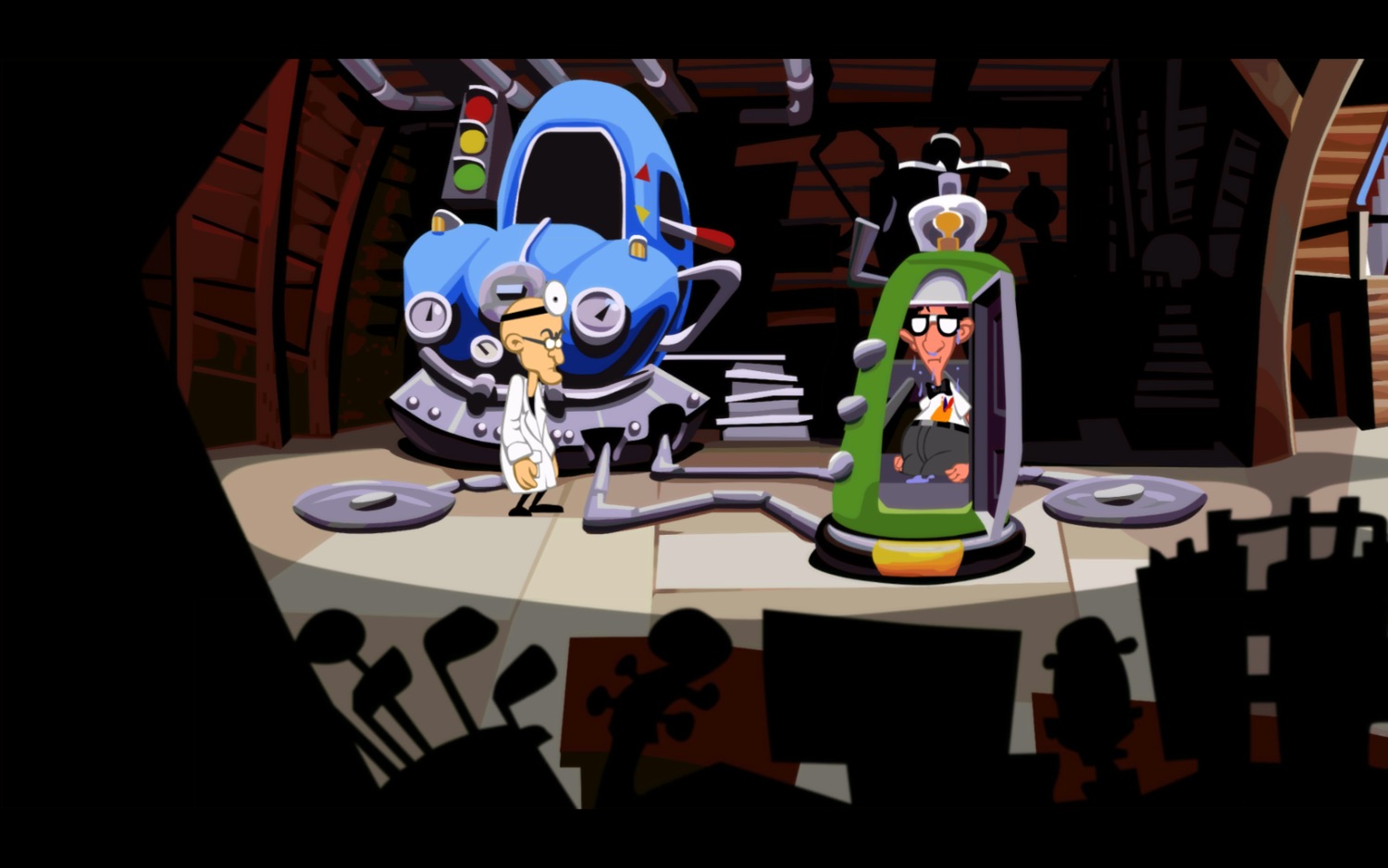 Screenshot of Dr Fred’s basement lab. The time machine is made out of an old car. Dr Fred is standing in front of it, looking at Bernard who is stepping out of the Chron-o-John looking a little bedazzled.